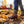 Bottes Muck Boot Muckster II Mid bordeaux portees dans les feuilles d automne