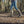 Bottes Muck Boot Arctic Sport II Tall vertes portees dans un chemin boueux