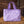 Sac Unicorn Academy lilas pose sur une botte de paille a l ecurie