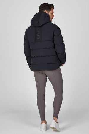 Veste matelassée homme Pikeur, coloris noir, porté vue de dos
