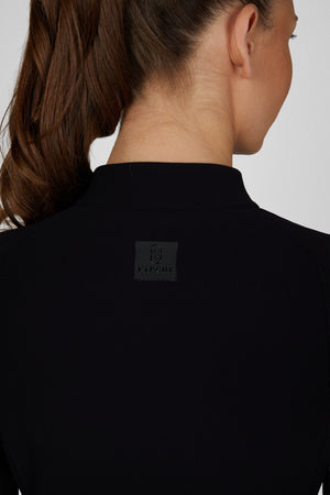 Pikeur ZIP RIP SHIRT polo de concours, coloris noir, porté vue de dos